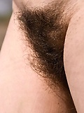 Extremely hairy cunt of nude older woman in the fresh air